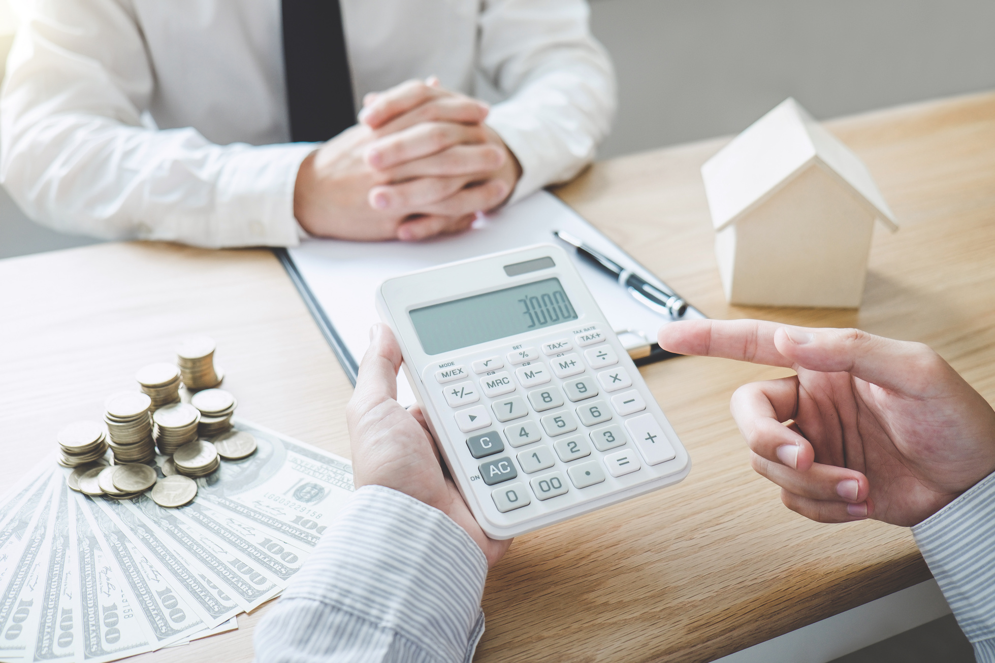 Business Signing and analyzing a contract buy - sell house, insurance agent analyzing cost about home investment loan Real Estate, Concept mortgage loan approval